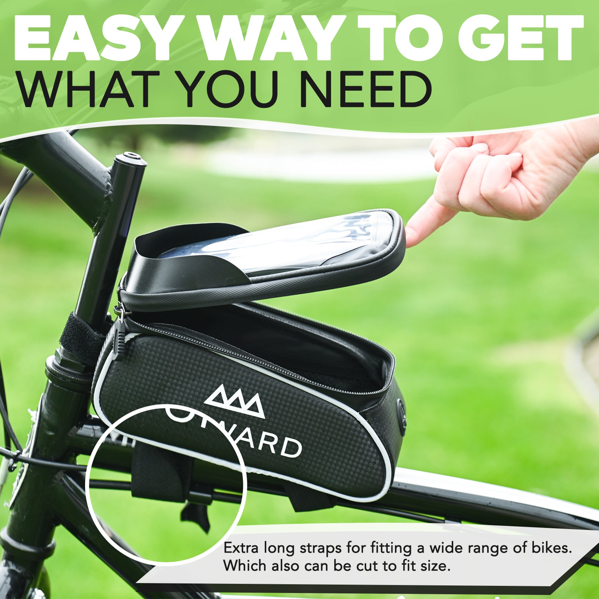 Bicycle frame bag with a hand pointing to it, set against a blurred green outdoor background.